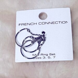 French Connection Silvertone  3 Ring Set with Chains. Sizes 3,5,7.